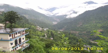 Madmaheshwar River in the background. Tunnel at end of zig-zag  road on opposite slope & landslides into Mandakini.